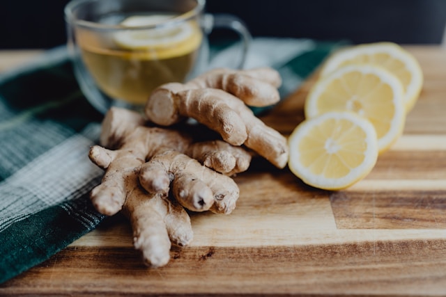  "Whole fresh ginger rhizome, sliced dried ginger, and ground ginger powder on neutral background"