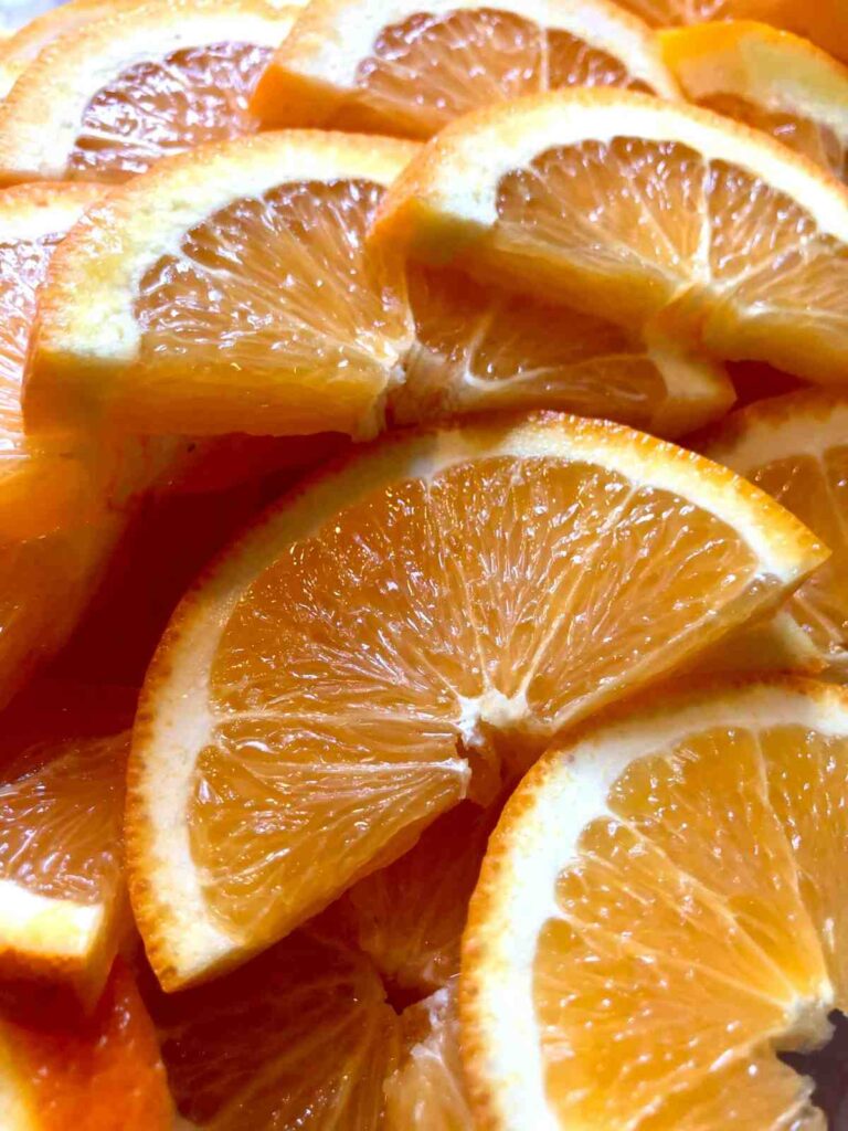 "Assortment of winter vegetables, citrus fruits, and warm soup representing seasonal healthy eating."