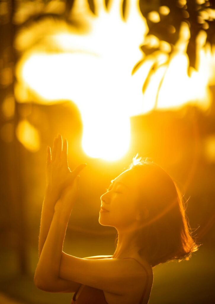  Woman enjoying morning sunlight exposure outdoors for circadian rhythm regulation