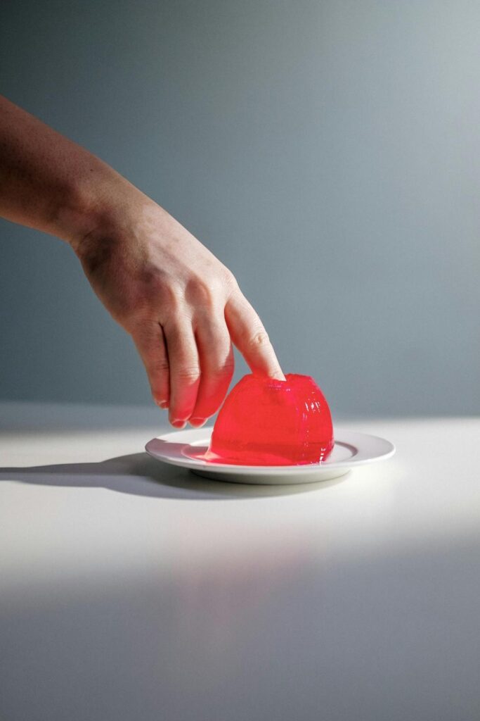 Medical illustration depicting soluble fiber absorbing water and forming gel-like substance in the intestine, slowing nutrient absorption