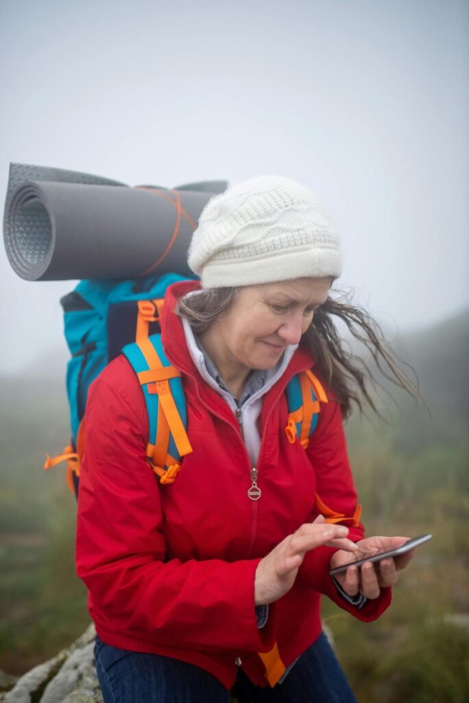 Active older woman enjoying a nature hike for bone health and strength