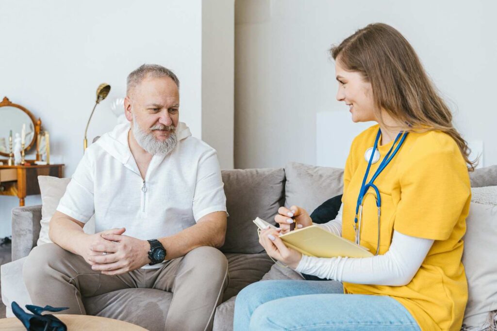  A young person sitting with a physician in a medical office, discussing heart health and prevention strategies heart attacks in young people
